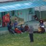 People sitting outside guest house in Lhagang.&nbsp;