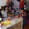 Men and&nbsp;women working at tailor shop.&nbsp;