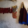 Clothing hanging in a tailor's shop&nbsp;