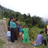 Village women and children cheering for their team