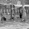 Pilgrims prostrating to the wall of carvings.