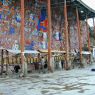 Pilgrims at the wall of carvings.