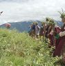 Bropon (lead master) making offering to the dieties as program starts