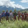 Bro dancers performing bro facing Bropon (Lead master) and also facing the big cypress tree