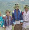 Holding their hand in hand wearing chrysanthemum  hats chanting and dancing