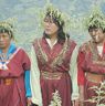 Beautiful ladies wearing shingka and chrysanthemum  hats joining their hands chanting Bro