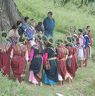 Bro participants gather near cypress tree and recites the text