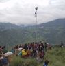 People gathers near flag to watch Bro