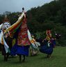 Gonpo and Gonmo dancing face to face while others dance in circle