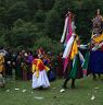 Nubchham dancers climbing the slope meadow as they dance