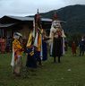 Nubchham dancers stand infront of temple