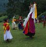 Gonpo Gonmo facing back to Kisibi temple while dancing infront of temple