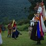 Other dancers dance while Gonpo Gonmo waits and stand