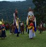 As Nubchham dancers dance in circle layman beats drum