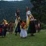 Gonpo Gonmo facing temple while others bend and dance