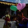 Monkey collecting money at Nangkor Tsechu