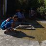 Village women making a place for Jagay by covering the cemented floor with cow dung