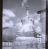 Reliquary monument on Lingkor with wall and mountains in background. Copyright Pitt Rivers Museum, University of Oxford 1999.23.1.10.2