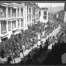 South side of Barkor facing east, with procession of armed cavalrymen. Copyright Pitt Rivers Museum, University of Oxford 1999.23.2.17