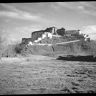 Northwest face of Potala seen from mid-distance with grassy foreground. Copyright Pitt Rivers Museum, University of Oxford 2001.35.114.1