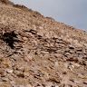 Terraced funerary structure FS4. Note the high forward wall and the way in which the side wall merges into the slope.