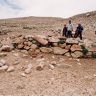 The survey team carrying out measurements on funerary structure FS34.