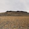 The tent-like rocky outcrop.