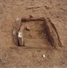 The square slab-wall structure east of the pillar array (Site 1).