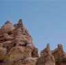 Inaccessible earthen and stone structures on high points.