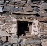 The detail of the window in one of the all-stone huts.