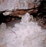 Masonry structure in the middle of the rear wall of the cave.