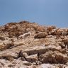 The staggered defensive wall fragments of the lower summit.