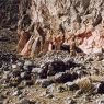 The adobe-block walls of Galo Puk (<i>gwa lo phug</i>) (Phase II) and the much more substantial outlying stone structures of the archaic cultural horizon (Phase I).