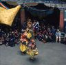 Laymen Dancers, "Dance of the Drummers from Dramitse" (dGra med rtse rnga 'cham), Paro Tshechu (tshes bcu), 1st day, in the dzong.