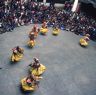 Laymen Dancers, "Dance of the Drummers from Dramitse" (dGra med rtse rnga 'cham), Paro Tshechu (tshes bcu), 1st day, in the dzong.