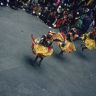 Laymen Dancers, "Dance of the Drummers from Dramitse" (dGra med rtse rnga 'cham), Paro Tshechu (tshes bcu), 1st day, in the dzong.