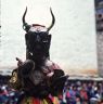 Layman Dancer with Garuda mask holding cymbals, "Dance of the Drummers from Dramitse" (dGra med rtse rnga 'cham), Paro Tshechu (tshes bcu), 1st day, in the dzong.