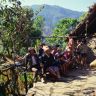 Guests, including Ramchandra, sitting on a bamboo platform 'pae lava'