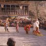 Milarepa, the hunter Gonpo Dorje, his servant Acho Pento and atsara, dance of Milarepa (Sha ba sha khyi 'cham), Paro Tshechu (tshes bcu), dance arena, Paro Tshechu (tshes bcu), 2nd day