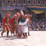 the servants couple saying good bye with atsara looking on, Dance of the Noblemen and the ladies (Pho legs mo legs), Paro Tshechu (tshes bcu), dance arena, Paro Tshechu (tshes bcu), 3rd day