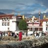 Jokhang main entrance, with the seventh-century Wönzhang Pillar (<i>rdo ring</i>) at the center left.