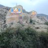 Large rock carvings of Tsongkhapa (left) and his disciple Khedrup (right), founding figures of the Geluk religious sect, of which Drepung is an important monastery.