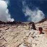 Members of the survey climbing up to the fortifications of the west saddle.