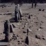 The remains of the west wall paralleling the row of standing stones.