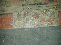 A close up of goddesses dancing in a scene on the walls of the inner circumambulation corridor.