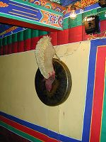 Yellow hat on the wall outside the Dalai Lama's sleeping quarters. ?????