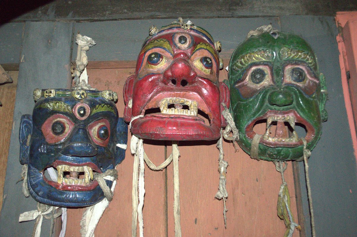 Wrathful wooden masks hang inside Ngangla Trong Lhakhang. | Mandala ...