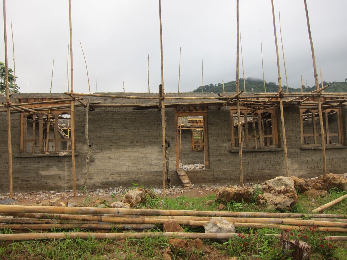 View of a Bhutanese house construction in process in Kengkhar village ...