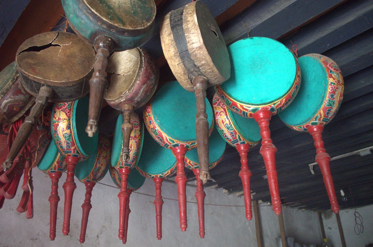 Mask drums hang from the ceiling in Gazari temple Mandala Collections
