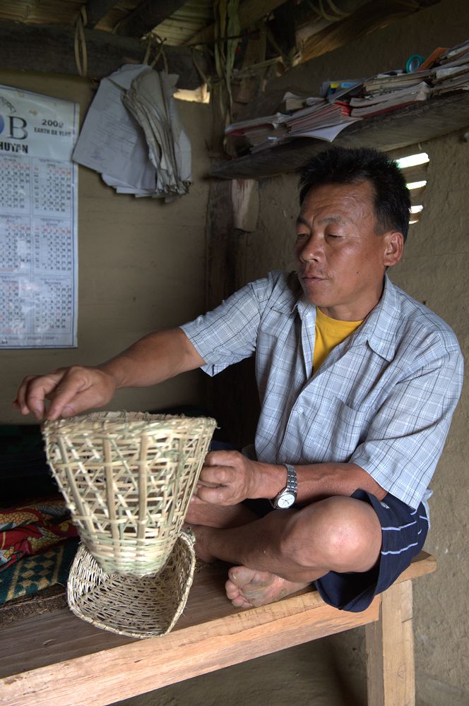 A Bhutanese man showing his bamboo baskets. | Mandala Collections - Images